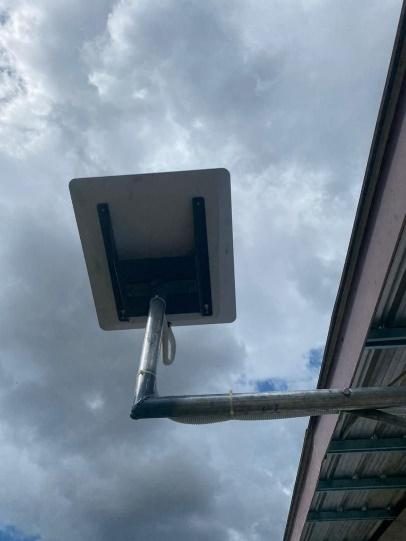 Terminal mounted at building edge